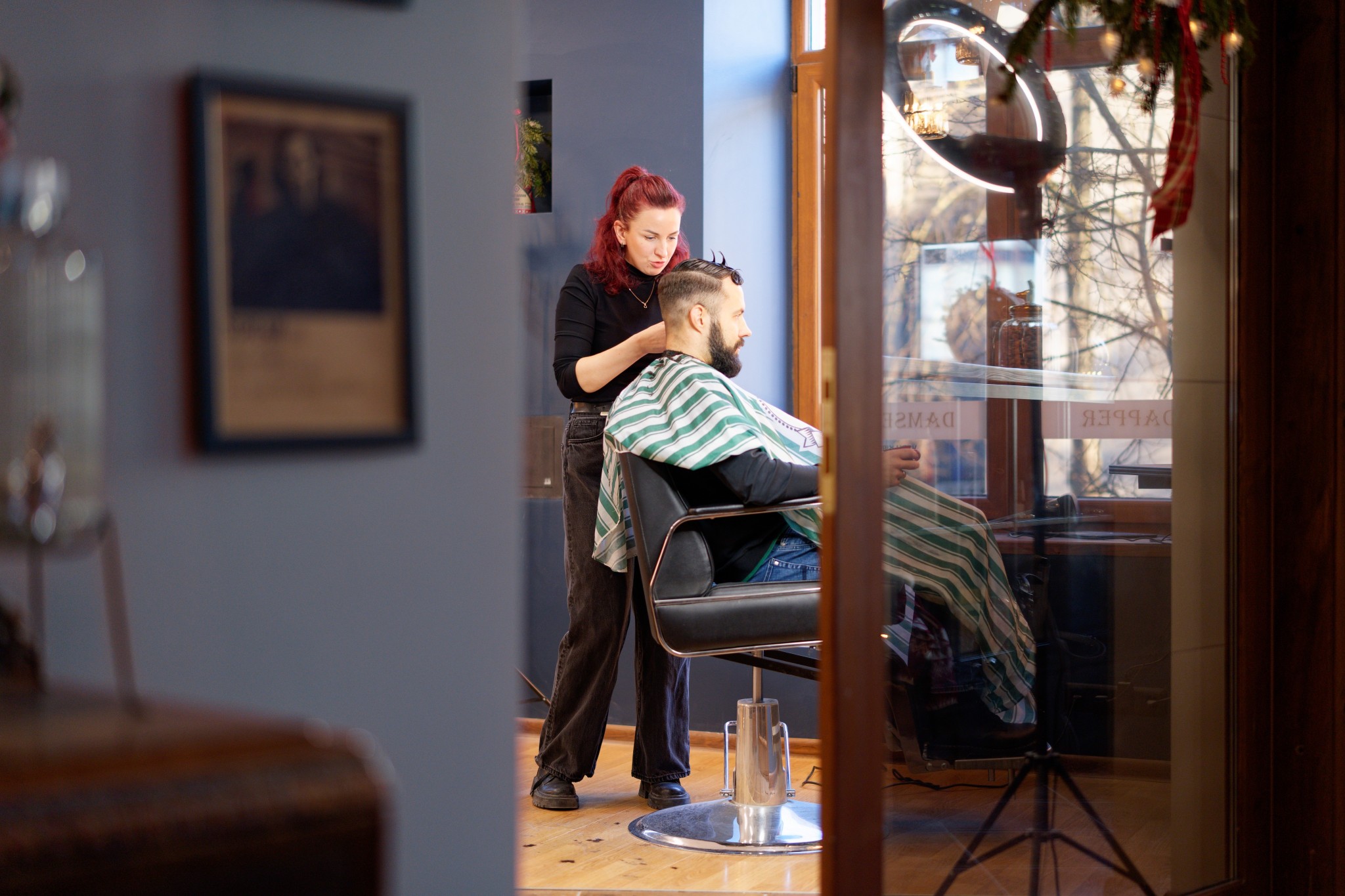 <p>Dapper Damsels Barbershop</p>